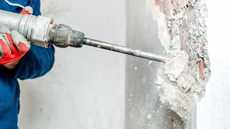 Interior demolition crew removing debris